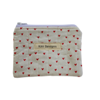 Small pouch with red heart pattern and 'Kitt Designs' label coin pouch