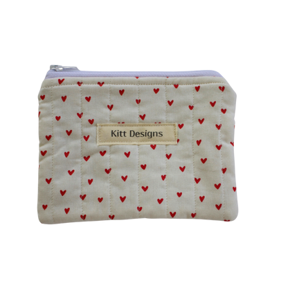 Small pouch with red heart pattern and 'Kitt Designs' label coin pouch