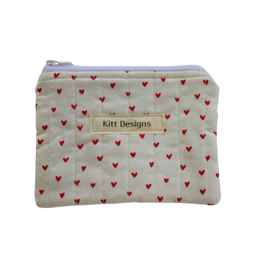 Small pouch with red heart pattern and 'Kitt Designs' label coin pouch