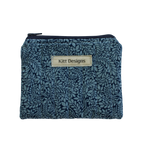 Blue floral patterned pouch with 'Kitt Designs' label coin pouch