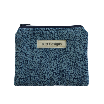 Blue floral patterned pouch with 'Kitt Designs' label coin pouch