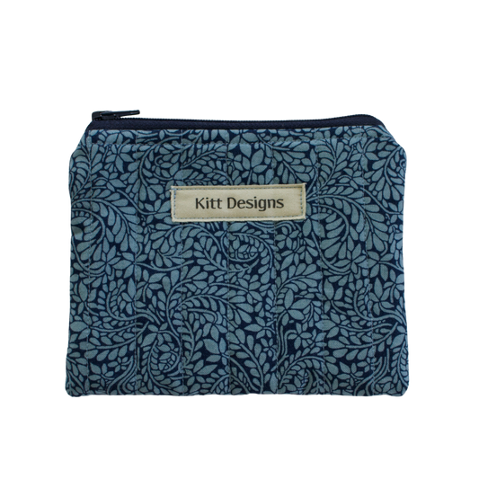 Blue floral patterned pouch with 'Kitt Designs' label coin pouch