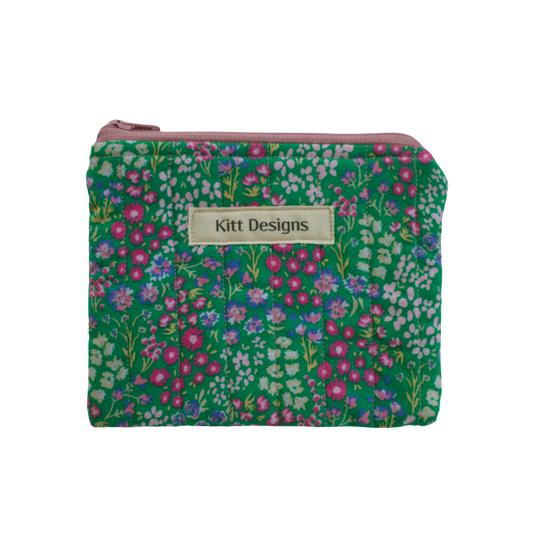 Floral patterned pouch with 'Kitt Designs' coin pouch