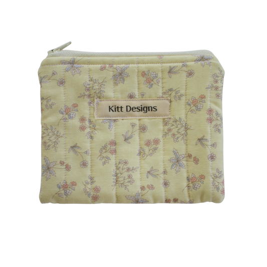 Floral patterned pouch with 'Kitt Designs' label coin pouch