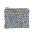 Floral patterned pouch with 'Kitt Designs' label coin pouch