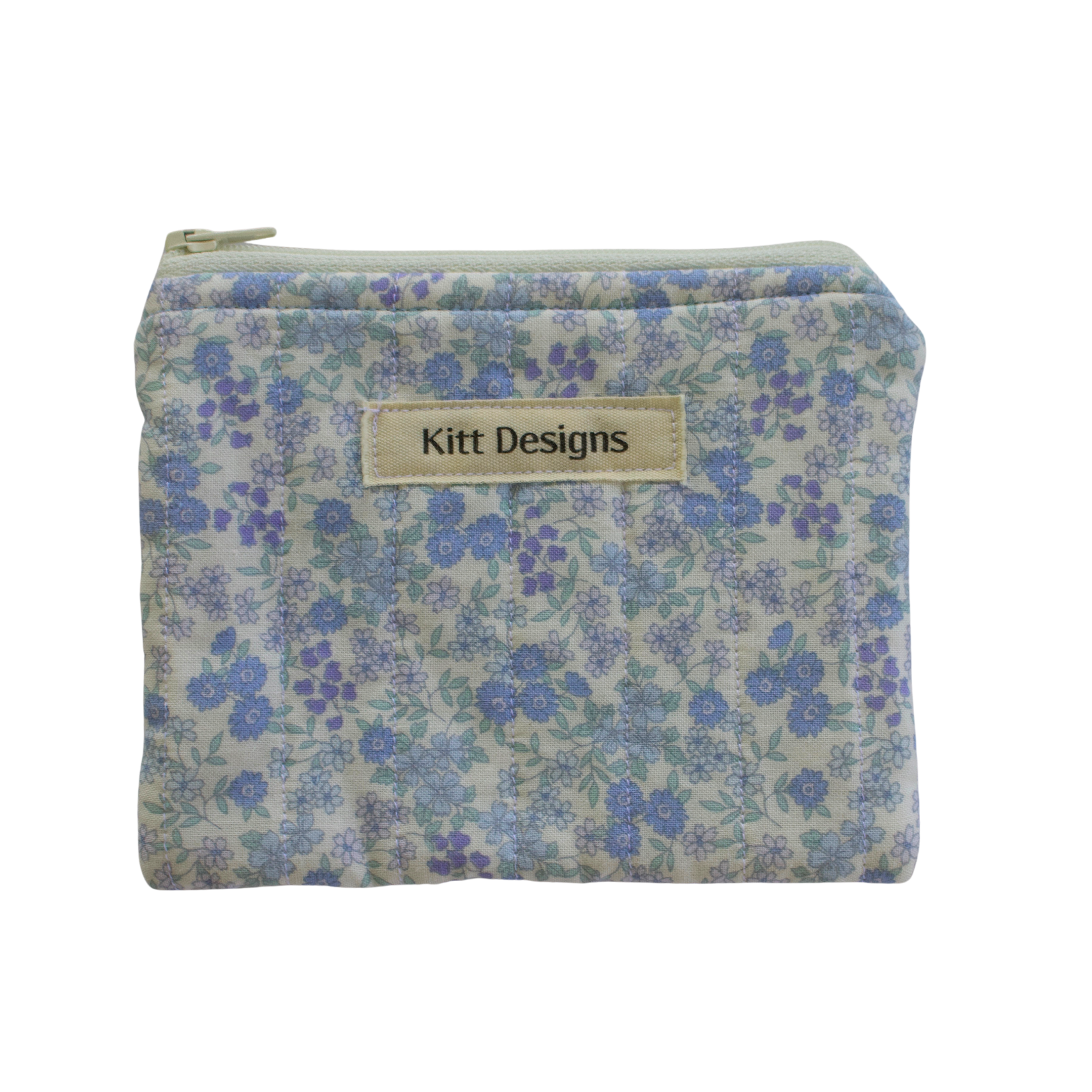 Floral patterned pouch with 'Kitt Designs' label coin pouch