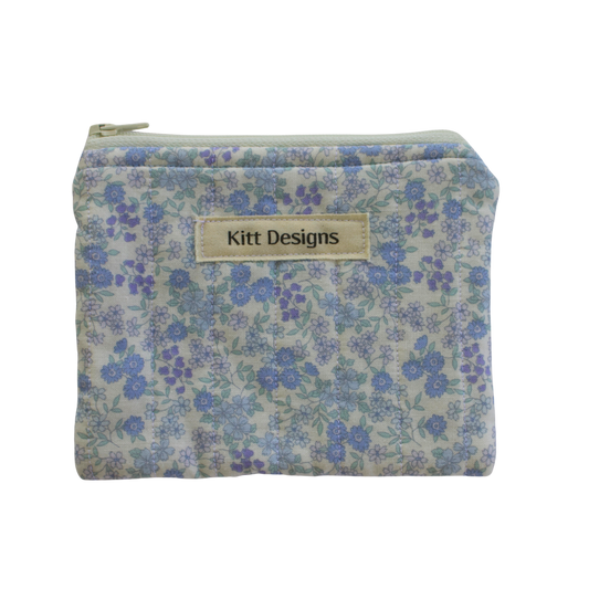 Floral patterned pouch with 'Kitt Designs' label coin pouch