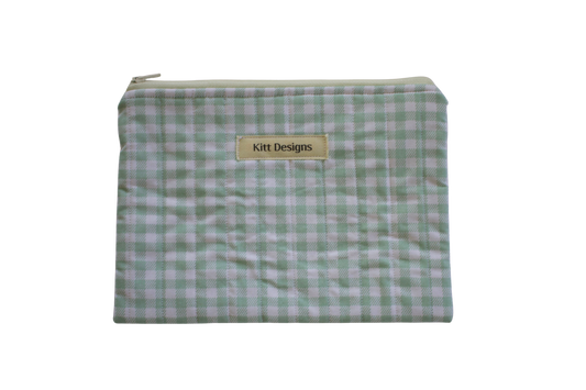 Green checkered pouch with 'Kitt Designs' label zipper pouch green gingham