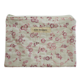 Floral-patterned pouch with 'Kitt Designs' label zipper pouch