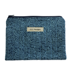 Floral patterned pouch with 'Kitt Designs' label zipper pouch