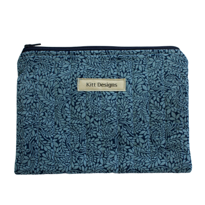 Floral patterned pouch with 'Kitt Designs' label zipper pouch