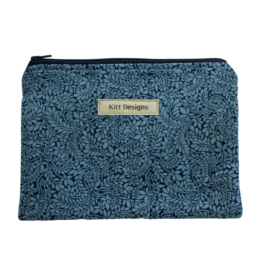 Floral patterned pouch with 'Kitt Designs' label zipper pouch
