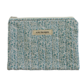 Patterned pouch with 'Kitt Designs' label zipper pouch