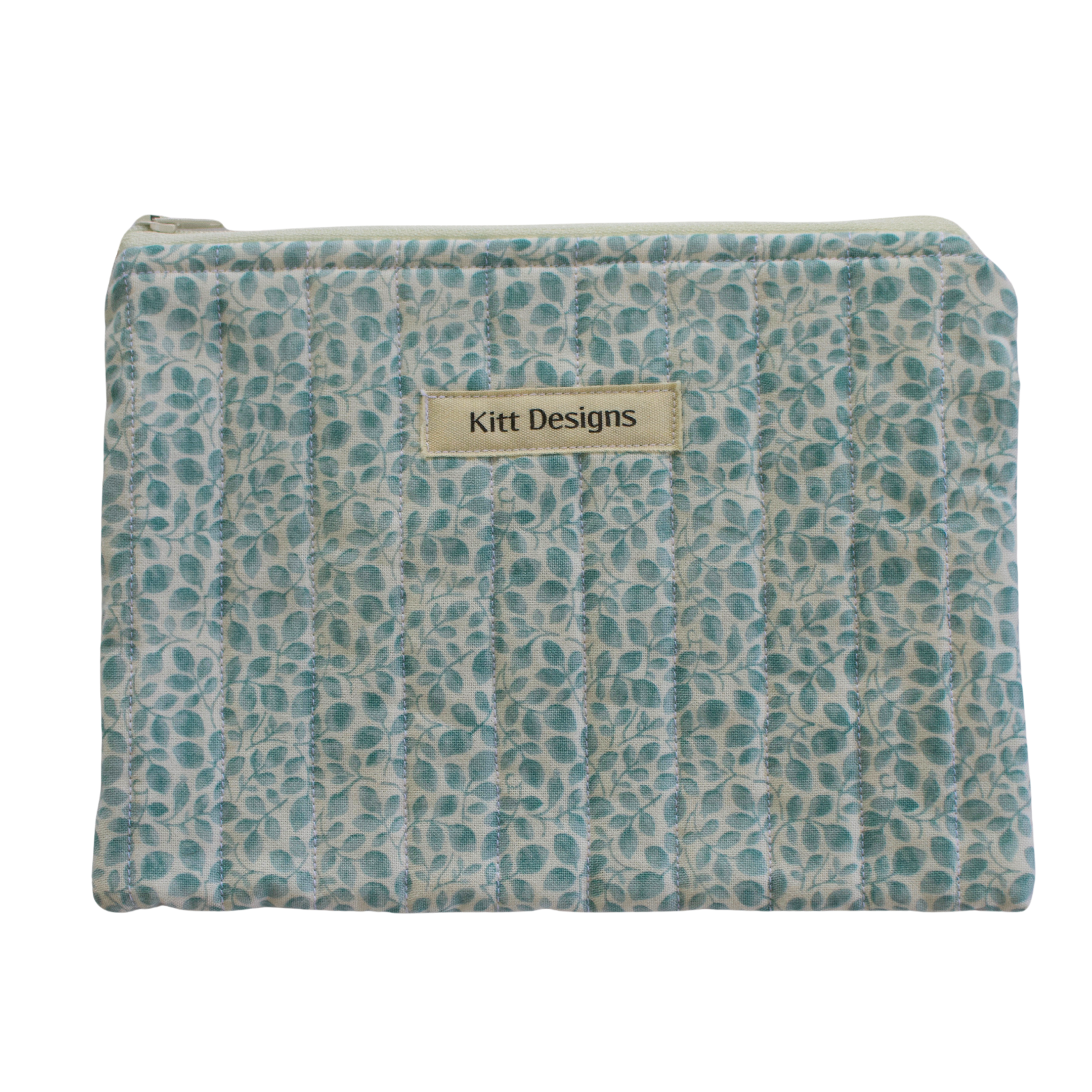 Patterned pouch with 'Kitt Designs' label zipper pouch