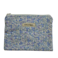 Floral patterned pouch with 'Kitt Designs' label zipper pouch