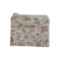 Floral-patterned pouch with 'Kitt Designs' label coin pouch