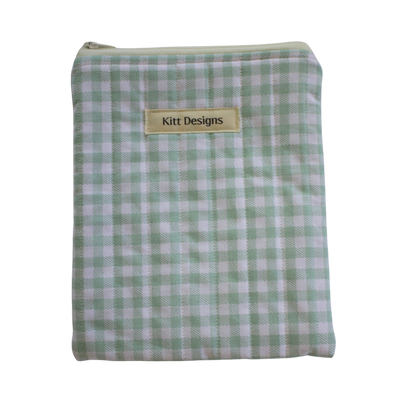 Green and white checkered pouch with 'Kitt Designs' label kindle pouch