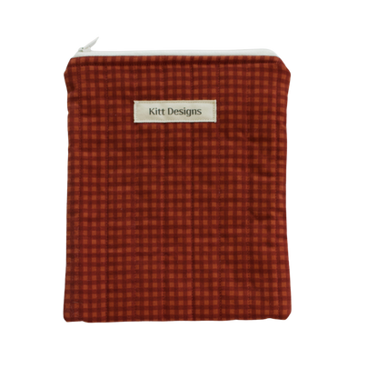 brown checkered pouch with 'Kitt Designs' label brown gingham kindle pouch