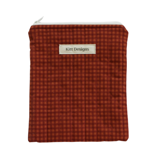 brown checkered pouch with 'Kitt Designs' label brown gingham kindle pouch