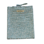 Floral patterned pouch with a visible brand label large book sleeve