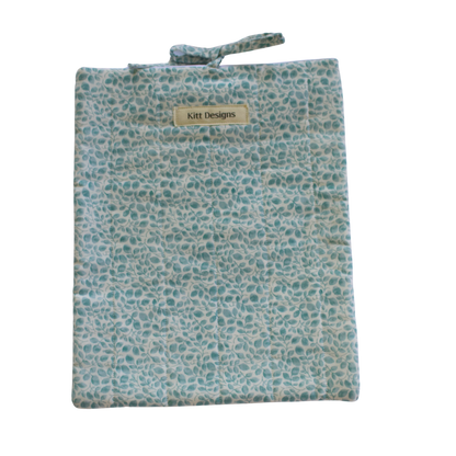 Floral patterned pouch with a visible brand label large book sleeve