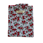 Floral patterned shirt with 'Kitt Designs' label small book sleeve