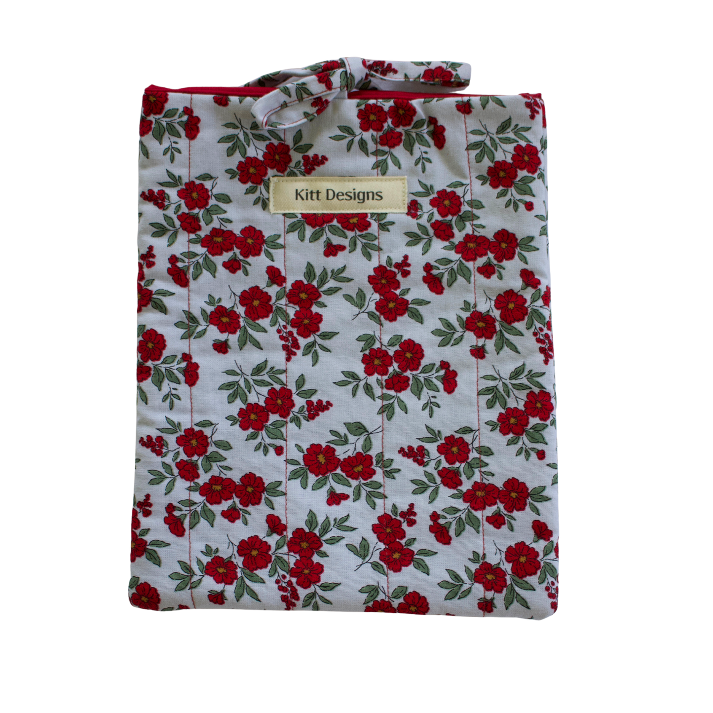Floral patterned shirt with 'Kitt Designs' label small book sleeve