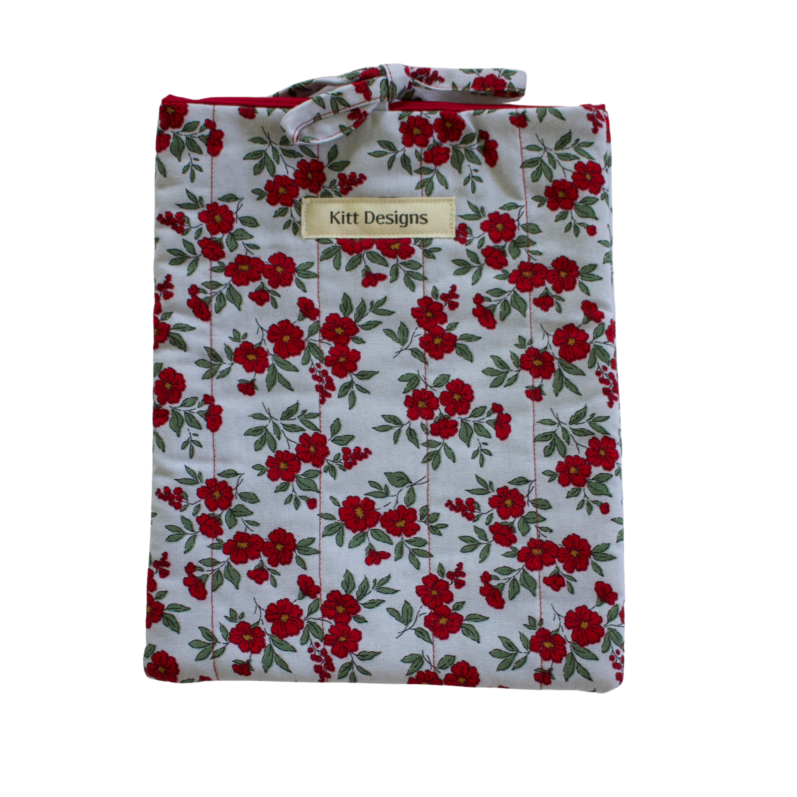 Floral patterned shirt with 'Kitt Designs' label small book sleeve