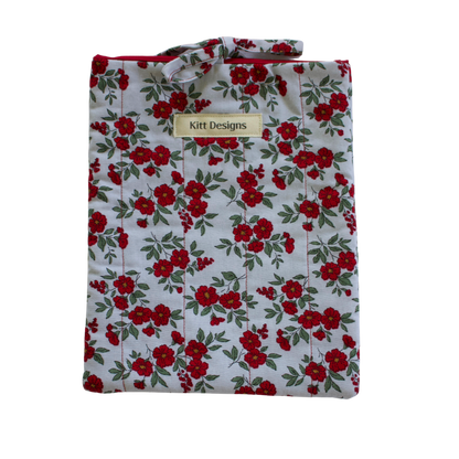 Floral patterned shirt with 'Kitt Designs' label small book sleeve
