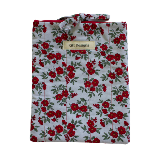 Floral patterned shirt with 'Kitt Designs' label small book sleeve
