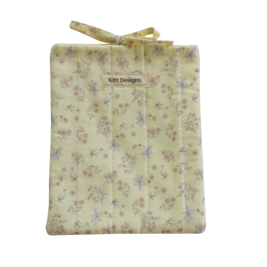 Floral-patterned fabric bag with 'Kitt Designs' small book sleeve