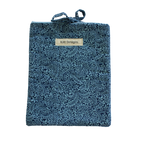 Blue textured pouch with a brand label small book sleeve