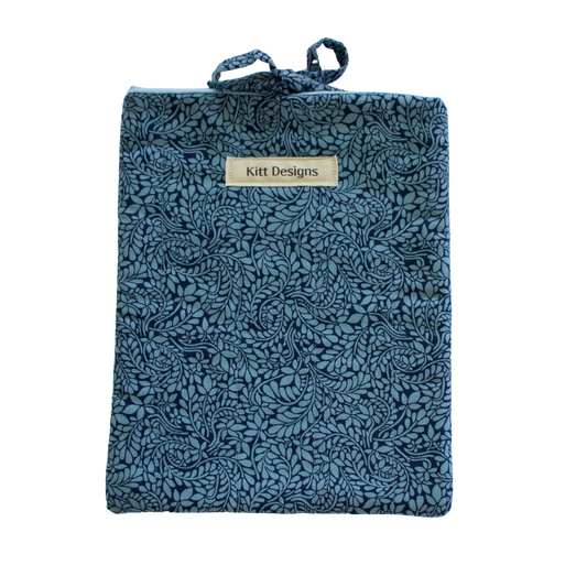 Blue textured pouch with a brand label small book sleeve