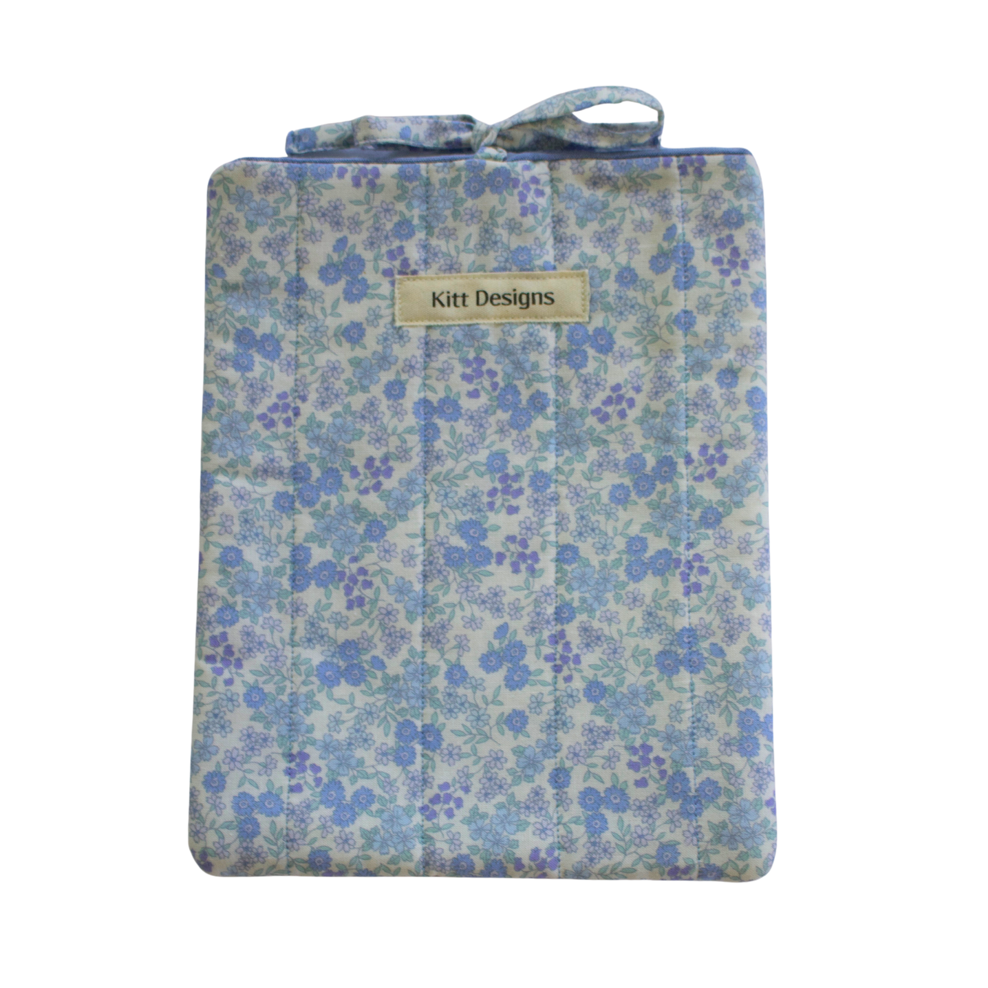 blue Floral-patterned pouch with 'Kitt Designs' branding small book sleeve