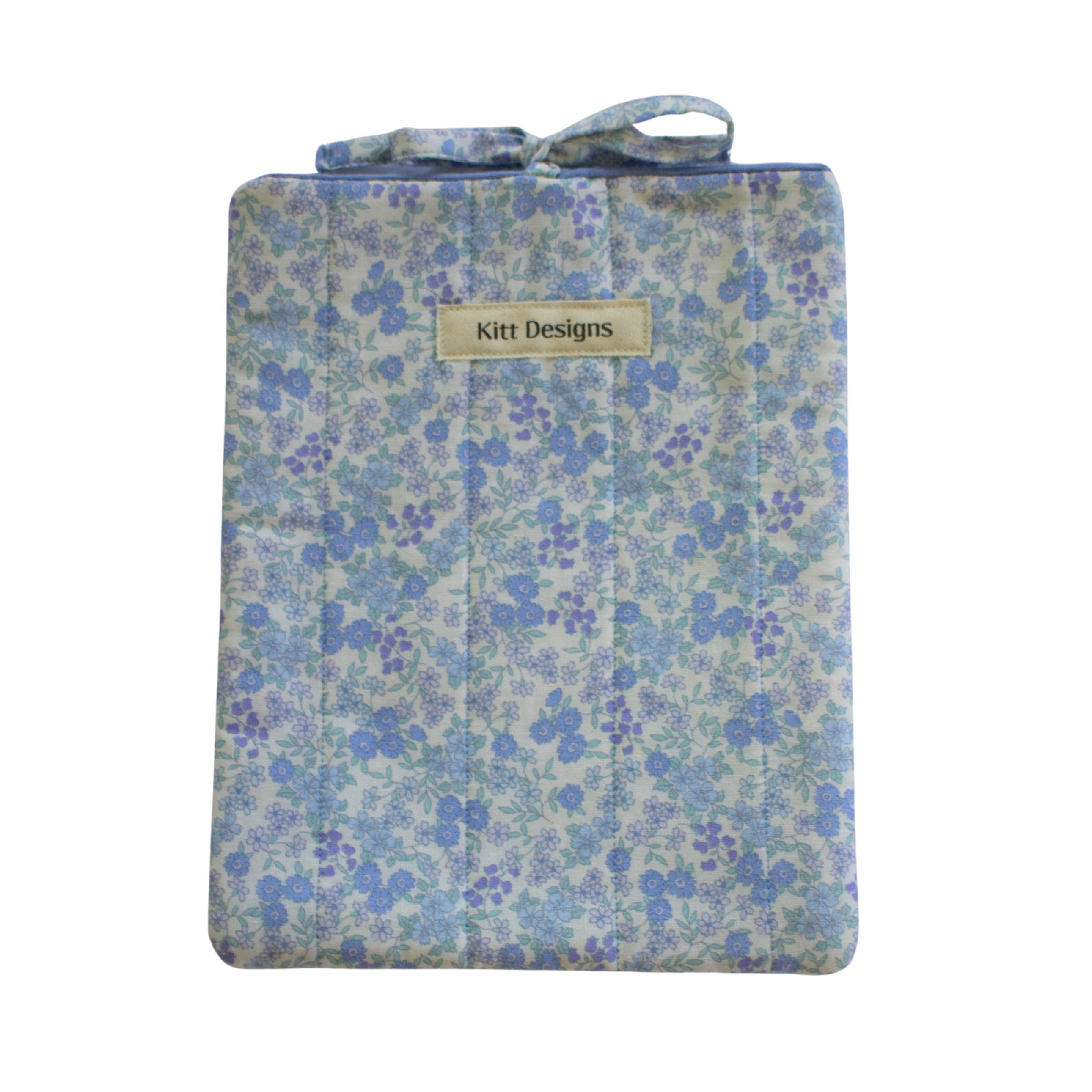 blue Floral-patterned pouch with 'Kitt Designs' branding small book sleeve